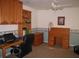 Well-lit office with custom cabinets, laminate wood desk, and an ergonomic desk chair at 506 Freeman St, Longwood, FL 32750