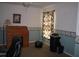 Well-lit office with custom cabinets, laminate wood desk, and an ergonomic desk chair at 506 Freeman St, Longwood, FL 32750
