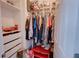 Organized walk-in closet featuring hanging rods, shelves, and drawers for optimal storage at 5201 Villa Rosa Ave, St Cloud, FL 34771