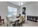 Bright dining room with a stone table, seating for six, and modern lighting fixture, great for gatherings at 5201 Villa Rosa Ave, St Cloud, FL 34771