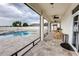 Covered patio view to the backyard showcasing a pool, outdoor kitchen, and lounge seating at 5201 Villa Rosa Ave, St Cloud, FL 34771