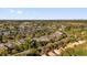 Aerial view of the community featuring lush landscaping, a pond, and surrounding neighborhoods at 6145 Froggatt St, Orlando, FL 32835