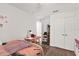 Neat bedroom with laminate floors, closet and desk at 6145 Froggatt St, Orlando, FL 32835