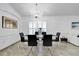 Dining room featuring a modern chandelier and seating for six at 6145 Froggatt St, Orlando, FL 32835