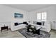 Bright living room featuring neutral paint, tile floors, and a comfortable white sofa at 6145 Froggatt St, Orlando, FL 32835