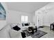 Bright living room featuring neutral paint, tile floors, and a comfortable white sofa at 6145 Froggatt St, Orlando, FL 32835