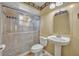 Bathroom featuring a glass-enclosed shower, pedestal sink, and decorative accents at 7529 Winter Shade Dr, Orlando, FL 32822