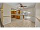 Kitchen and living room, a kitchen featuring oak cabinets and stainless steel appliances at 7529 Winter Shade Dr, Orlando, FL 32822