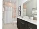 Modern bathroom with a shower-tub combo, sleek vanity, and stylish decor at 7740 Sandy Ridge Dr # 136, Reunion, FL 34747