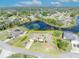 Aerial view of home with surrounding boundary lines near a tranquil lake and lush landscaping, offering a serene living environment at 789 Kangaroo Ct, Deltona, FL 32738