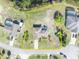 Aerial view of the house, property, and surrounding neighborhood with a well-manicured lawn and mature landscaping at 789 Kangaroo Ct, Deltona, FL 32738