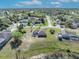 Stunning aerial view of a home with a lakeside backyard and lush green surroundings at 789 Kangaroo Ct, Deltona, FL 32738