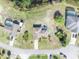 Aerial view of the house, property, and surrounding neighborhood with a well-manicured lawn and mature landscaping at 789 Kangaroo Ct, Deltona, FL 32738