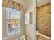 Shower and window offers natural light and scenery in this bathroom at 789 Kangaroo Ct, Deltona, FL 32738