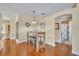 Dining area featuring wooden breakfast table with bar seating and hardwood floors at 789 Kangaroo Ct, Deltona, FL 32738