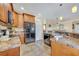 Kitchen featuring stainless appliances and granite countertops with tiled floors at 789 Kangaroo Ct, Deltona, FL 32738