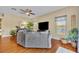 View of the living room features hardwood floors and natural light from the backyard at 789 Kangaroo Ct, Deltona, FL 32738