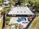 Aerial view showcases pool, outdoor bar, and putting green at 8905 South Bay Dr, Orlando, FL 32819