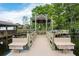 Picturesque wooden dock and gazebo overlooking the water and boat house at 8905 South Bay Dr, Orlando, FL 32819