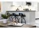 View of the kitchen from the living room with a modern coffee table at 8905 South Bay Dr, Orlando, FL 32819