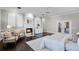 The main bedroom offers dark wood flooring, a fireplace, and serene seating beneath the window at 8905 South Bay Dr, Orlando, FL 32819