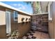 The outdoor shower includes wood-style tiles, wall decor and checkerboard flooring at 8905 South Bay Dr, Orlando, FL 32819