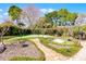 Beautiful backyard putting green with a sand trap and landscaped surroundings at 8905 South Bay Dr, Orlando, FL 32819