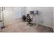 Inviting office features plush carpet, natural light, and a modern adjustable standing desk at 9732 Brown Burrow St, Orlando, FL 32829