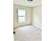 Bright bedroom with soft carpet, and natural light from the window at 1028 Henson Ct, Oviedo, FL 32765