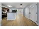 A kitchen view showcasing wooden cabinets, a breakfast bar, and seamlessly connected spaces at 10526 Fernando St, Orlando, FL 32825