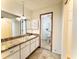 Bathroom with granite counters, vanity with storage, and neutral color palette at 10631 Deergrass Ln, Orlando, FL 32821