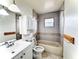 Bathroom featuring a bathtub, shower, toilet, vanity, and neutral tile at 10631 Deergrass Ln, Orlando, FL 32821