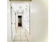 Hallway with tile floors and neutral paint at 10631 Deergrass Ln, Orlando, FL 32821