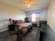 This bedroom features a ceiling fan, and modern floors at 10912 Smokey Ridge Ct, Clermont, FL 34711