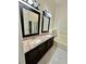 Bathroom features a double sink vanity with granite countertop, and a tub shower at 12526 Ringwood Ave, Orlando, FL 32837