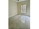 Bedroom with neutral paint, tiled floor, and a window at 12526 Ringwood Ave, Orlando, FL 32837