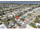 An aerial shot highlights the neighborhood near a body of water and home's location at 134 Roberta Rd, Ormond Beach, FL 32176