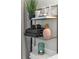 Bathroom with tiled shower, storage rack, and decorative accents at 134 Roberta Rd, Ormond Beach, FL 32176