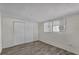 Bedroom with wood-look flooring, closet, and a window for natural light at 134 Roberta Rd, Ormond Beach, FL 32176