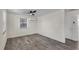 A simple, clean bedroom space with light gray floors, white walls, and minimalist features at 134 Roberta Rd, Ormond Beach, FL 32176