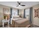 Bright bedroom with a ceiling fan, cozy decor, and natural light from the window at 134 Roberta Rd, Ormond Beach, FL 32176