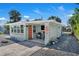 Charming exterior featuring a quaint seating area and a whimsical seahorse design at 134 Roberta Rd, Ormond Beach, FL 32176