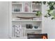 Built in shelving featuring decorative elements, dinnerware and a neutral design at 134 Roberta Rd, Ormond Beach, FL 32176