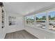 Bright sun room featuring large windows, light gray flooring, and neutral decor at 134 Roberta Rd, Ormond Beach, FL 32176