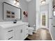 Bright bathroom featuring a modern vanity, framed mirror, and a walk-in shower at 1415 Crocus Ct, Longwood, FL 32750