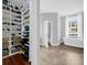 Bathroom with a walk in closet, bathtub, and natural light from the large window at 1415 Crocus Ct, Longwood, FL 32750