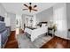 Inviting bedroom showcasing hardwood floors and a ceiling fan at 1415 Crocus Ct, Longwood, FL 32750