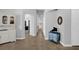 Long hallway with tile floor featuring an arched doorway and view into other rooms at 1415 Crocus Ct, Longwood, FL 32750