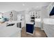 Well-lit kitchen featuring a center island, stainless steel appliances, and ample cabinet space at 1415 Crocus Ct, Longwood, FL 32750