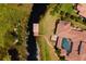 Aerial view featuring dock access and landscaping along the waterfront at 14645 Isleview Dr, Winter Garden, FL 34787